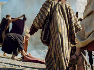 Many of them took the garments they had brought with them for the week of celebration and laid them on the ground