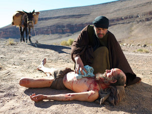 Gently he wrapped bandages around the sores