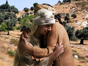 His father grabbed him with wide-open arms and hugged him