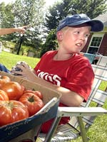 Boy sells veggies