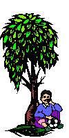 boy sitting under a tree