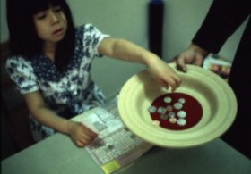 Little girl giving her offering