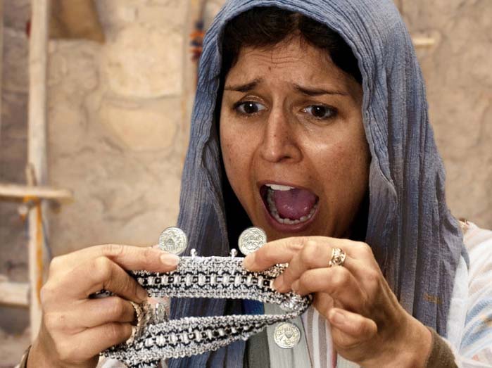 woman counting her coins